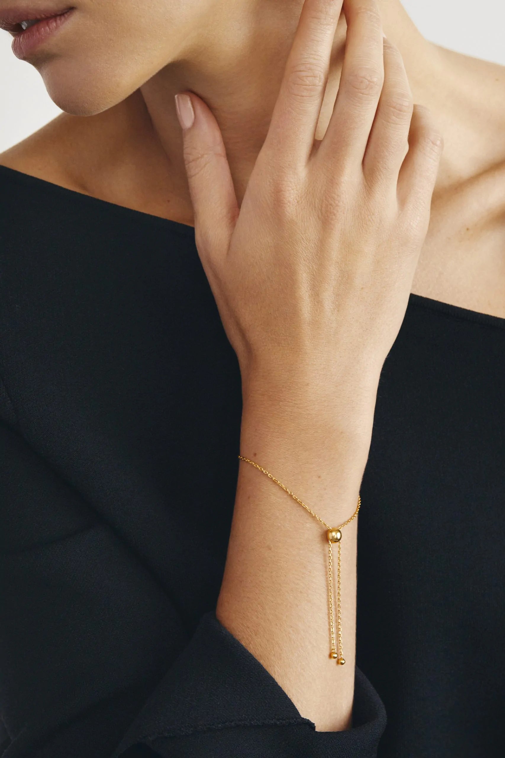 Bracelet, arc with chain and balls, yellow gold