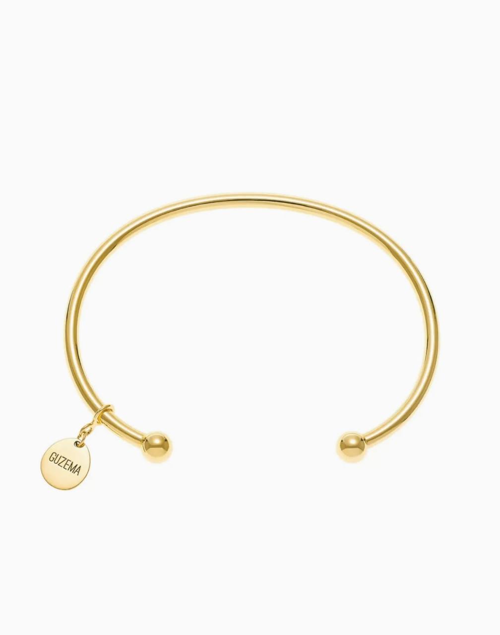 Arc bracelet with a club, yellow gold