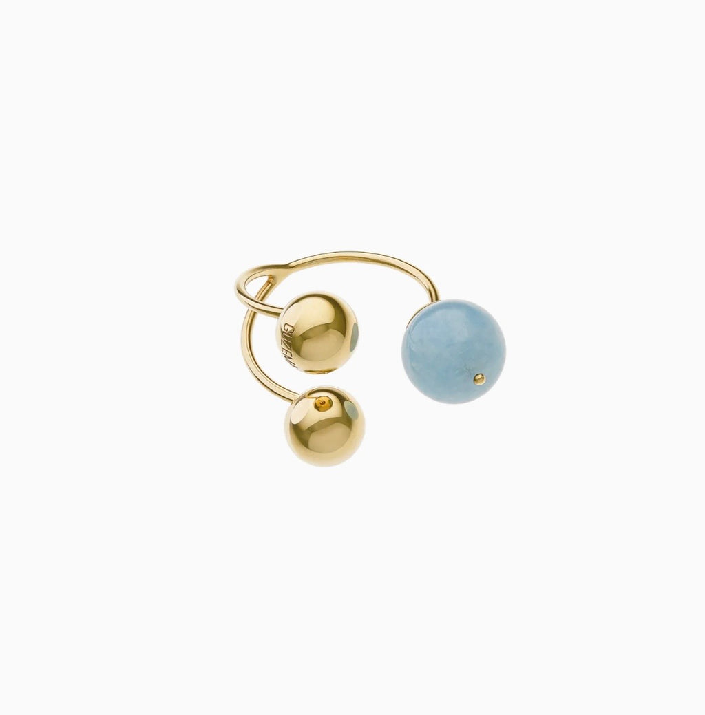 Ring with two gold and one aquamarine spheres, yellow gold