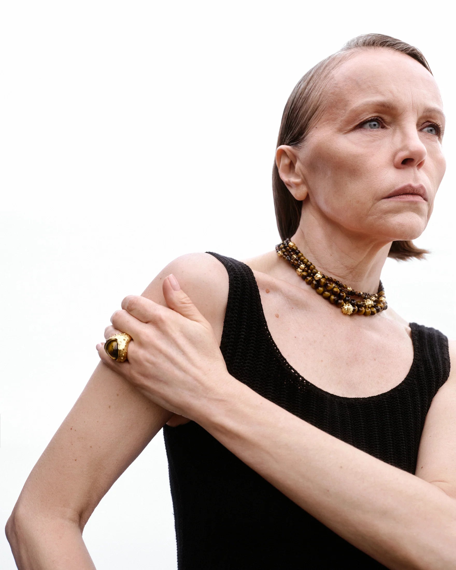K12 Necklace of nine chestnuts made of brass covered with 24 carat gold plating and tiger's eye / length 36 cm